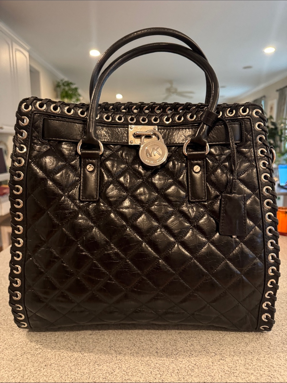 Michael Kors Black Quilted Leather Satchel with Eyelet Trim and Gold-Tone Lock